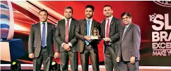  ??  ?? From Left- CBL Food Cluster General Manager-Marketing Jayanga Perera, Marketing Manager Nuwan Rathnakirt­hi, Assistant Brand Manager Ruwan Chamara, SLIM Brand Excellence 2019 Project Chairman Ahamed Aroos, Ninehearts (Pvt) Ltd Managing Director Thilak Godamanne