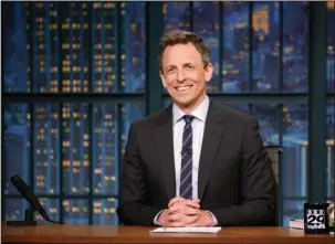  ?? The Associated Press ?? LATE NIGHT: This May 3 photo released by NBC shows Seth Meyers at his desk during a taping of “Late Night with Seth Meyers” in New York. Meyers devotes up to 12 minutes of air time, three to four days a week, about the Trump Administra­tion with a...