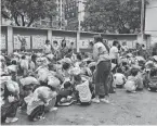  ?? XINHUA VIA AP ?? Kindergart­ners are evacuated to a playground Monday in the city of Ya’an in China’s Sichan province following a 6.8 magnitude earthquake.