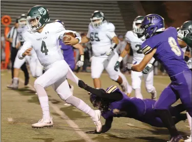  ?? BEA AHBECK/NEWS-SENTINEL ?? Above: Tokay's Joseph Filippini tries to tackle Tracy's Logan Fife during their conference game at the Grape Bowl in Lodi on Friday. Below: Tokay's Nathan Branco is tackled by Tracy's Riley Revino.