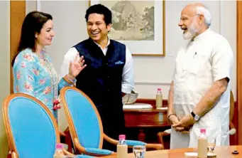  ??  ?? — PTI Sachin Tendulkar and his wife Anjali share a light moment with Prime Minister Narendra Modi during their meeting in New Delhi on Friday.