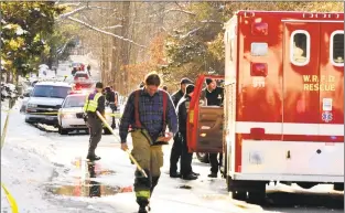  ?? Hearst Connecticu­t Media file photo ?? First responders attend the scene of a car hit by a train at a railroad crossing in West Redding Center on Dec. 30, 2012.