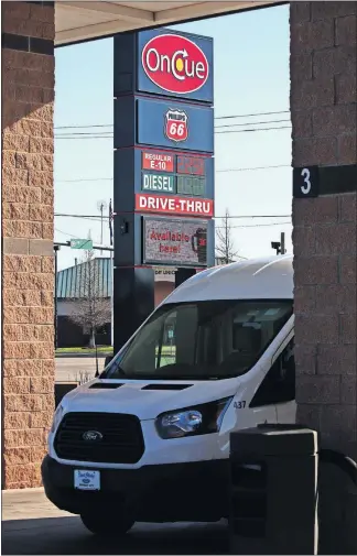  ?? [DOUG HOKE/THE OKLAHOMAN] ?? A sign at an OnCue at 15035 N. May Ave. in Oklahoma City advertises fuel prices Thursday morning.