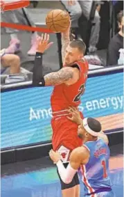  ?? GETTY ?? Bulls’ Daniel Theis rebounds over Bruce Brown Sunday at United Center in Chicago.