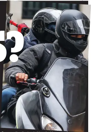  ??  ?? Terror on the city streets: Moped robbers armed with a hammer roar around Central London