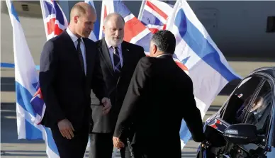  ?? (Amir Cohen/Reuters) ?? PRINCE WILLIAM is greeted at Ben-Gurion Airport yesterday upon his arrival.