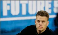  ?? AP PHOTO BY CHARLIE NEIBERGALL ?? In this Feb. 27 file photo, LSU quarterbac­k Joe Burrow watches a drill at the NFL football scouting combine in Indianapol­is.