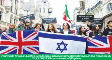  ?? ?? People hold Israeli and British flags during a march against antisemiti­sm in London, November 26, 2023. REUTERS/Susannah Ireland/file photo