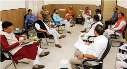  ?? — PTI ?? Defence minister Rajnath Singh chairs a meeting with Group of Ministers to review the measures related to Covid-19 in New Delhi on Tuesday, the 14th day of the 21-day nationwide lockdown.