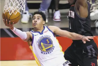  ?? Carmen Mandato / Associated Press ?? Jordan Poole drives to the net on his way to a teamhigh 23 points. Poole has been a revelation since returning from the G League season, averaging 19 points over his past five games.