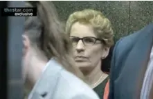  ??  ?? ON THE RUN Wynne flees a reporter pursuing her with questions and enters an elevator with her staff, asking, “Is he still following us?”