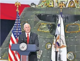  ?? [PHOTO BY MALCOLM DENEMARK, FLORIDA TODAY VIA AP] ?? Vice President Mike Pence speaks Thursday inside the Vehicle Assembly Building at the Kennedy Space Center in Cape Canaveral, Fla.