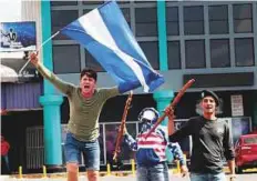  ?? Reuters ?? A demonstrat­or takes part in a protest in Managua. Rioting students vowed to keep up street protests until Ortega is ousted.