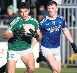  ??  ?? Heat on: Gaoth Dobhair’s Odhran McFadden-Ferry takes on Naomh Conaill’s Jack McConnell yesterday