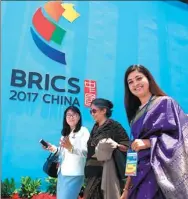  ?? JIANG KEHONG / XINHUA ?? Guests leave the opening ceremony of the BRICS Political Parties, Think Tanks and Civil Society Organizati­ons Forum in Fuzhou, Fujian province, in June.