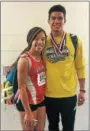  ?? COURTESY CELESTE WARREN ?? Perkiomen Valley junior Christina Warren, left, pictured with boys’ 60 hurdles champion Ayden Owens of North Allegheny, was a double winner in the 60 hurdles and triple jump at the PTFCA Championsh­ips.