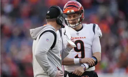  ?? ?? Joe Burrow talks with head coach Zac Taylor during a game in December. Photograph: David Zalubowski/AP