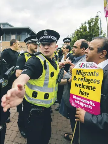  ??  ?? Protesters chained the gates of the Home Office in Glasgow yesterday in support of two asylum seekers on hunger strike as staff were overpowere­d. Police arrived and an arrest was made.