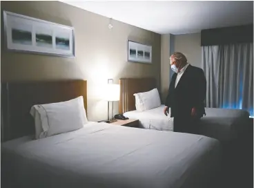  ?? NATHAN denette / THE CANADIAN PRESS ?? Ontario Premier Doug Ford visits the Holiday Inn Express and Suites,
which is used as a COVID-19 isolation hotel, in Oshawa last week.