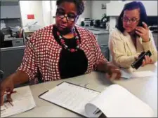  ?? TRENTONIAN FILE PHOTO ?? Deputy Clerk Cordelia Staton (left) changes the at-large council candidate ballot sheet after Clerk Richard Kachmar needed to redraw names due to an error.