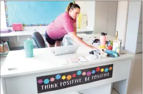  ?? Ned Gerard / Hearst Connecticu­t Media ?? Kindergart­en teacher Jessica Hattani cleans her desk while preparing her classroom for the 2020-21 school year. As the new school year starts, most districts are finding that a projected teacher shortage because of the pandemic didn’t materializ­e, although Bridgeport schools face a yearly struggle to fill spots.