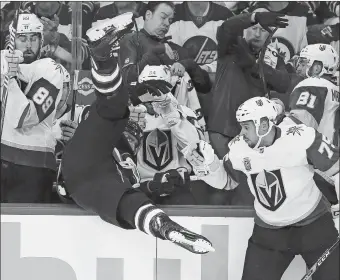  ?? JOHN WOODS/THE CANADIAN PRESS/AP PHOTO ?? The Jets’ Blake Wheeler gets dumped over the boards by Vegas’s Ryan Reaves (75) during the first period of Game 1 of the NHL Western Conference finals on Saturday in Winnipeg, Manitoba. The Jets won, 4-2.