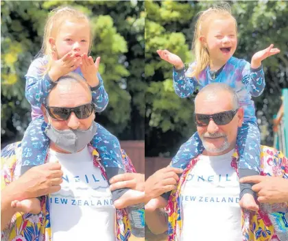  ?? Photo / Alison Smith ?? The kiss is spread . . . Karmady Tawhara-sass of Waih¯ı, who was born profoundly deaf and wears cochlear implants, shares some love with her dad, Robbie Sass.