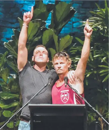  ??  ?? TOUGH LOSS: Ruben McDornan (left), who was the sole survivor of the sunken trawler MV Dianne, points to the sky with second skipper Adam Kelly at the memorial service for the lost crew members in Cairns on October 31 last year.