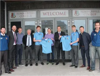  ??  ?? Former Summerhill players John Kent (‘ 75) and Tommy Breheny (‘ 85) and former coach Tommy McManus pictured with current players and management . Money left over from their reunion was donated to Summerhill College’s senior gaelic team in the form of a...