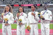  ?? Kirby lee/ uSa Today Sports ?? Sydney McLaughlin, Allyson Felix, Dalilah Muhammad, Athing Mu celebrates winning the gold medal in the women’s 4x400 relay final during the Tokyo 2020 Olympic Summer Games at Olympic Stadium.