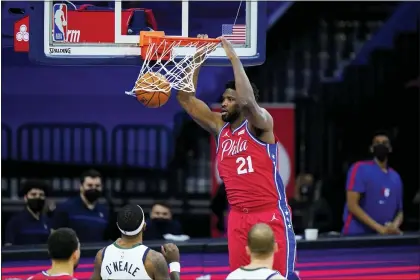  ?? MATT SLOCUM — THE ASSOCIATED PRESS ?? Sixers’ Joel Embiid dunks the ball during a game against the Utah Jazz last Wednesday in Philadelph­ia.