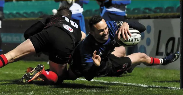  ?? SPORTSFILE ?? Dave Kearney dives in for the first try of Leinster’s 24-12 win over Ulster at the RDS on Friday night.