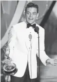  ??  ?? Rami Malek of Mr. Robot celebrates his award for best actor in a drama series.