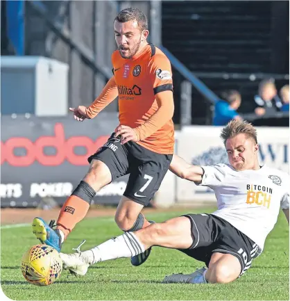  ??  ?? Dundee United’s Paul McMullan loses out to Ayr United’s Alan Forrest