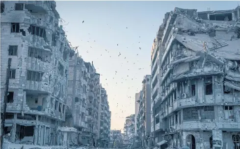  ?? THE NEW YORK TIMES ?? Destroyed buildings in the centre of Homs, Syria. During the six-year conflict, a large majority of the atrocities have been carried out by President Bashar al-Assad’s government, which has all the tools of a state — a formal military and air force, a...