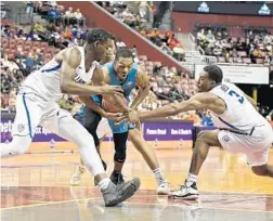  ?? MICHAEL LAUGHLIN/SUN SENTINEL PHOTO ?? State’s Trent Forrest tries to keep control of the ball against Saint Louis.