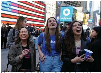  ?? (AP/Richard Drew) ?? Coinbase employees celebrate Wednesday outside the Nasdaq MarketSite in New York’s Times Square as the digital currency exchange became a publicly traded company.