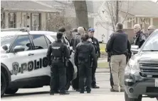  ?? VIA AP ?? Law-enforcemen­t personnel at the scene where four people died in a stabbing rampage in Rockford, Illinois, on Wednesday.