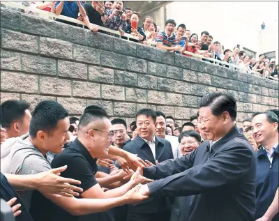  ?? LI XUEREN / XINHUA ?? President Xi Jinping is greeted by students and faculty at the China University of Political Science and Law in Beijing on Wednesday.