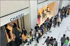  ?? PROVIDED TO CHINA DAILY ?? Customers line up outside a luxury shop at the SKP department store in Beijing on March 27, 2021.