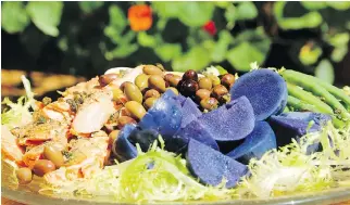  ?? JULIE OLIVER/OTTAWA CITIZEN ?? Purple potatoes, crunchy fried capers and cedar-planked salmon are colourful twists on the classic Niçoise salad.