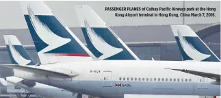  ??  ?? PASSENGER PLANES of Cathay Pacific Airways park at the Hong Kong Airport terminal in Hong Kong, China March 7, 2016.