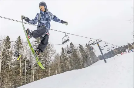  ?? LUIS SÁNCHEZ SATURNO/THE NEW MEXICAN ?? Joey Capone of Albuquerqu­e jumps on the terrain park Monday at Ski Santa Fe. Following a late-winter storm, Ski Santa Fe, with a base of 70 inches, reported a few inches of fresh snow Monday. Officials said the ski basin has seen 264 inches of natural snowfall this winter.