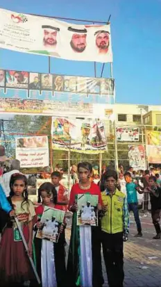  ?? WAM ?? Expressing their gratitude Children in Aden show their respect and appreciati­on for the UAE on Commemorat­ion Day.