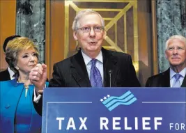  ?? J. Scott Applewhite ?? The Associated Press Senate Majority Leader Mitch Mcconnell, R-KY., flanked by, Small Business Administra­tion chief Linda Mcmahon, left, and Sen. Roger Wicker, R-miss., speaks to a group of small-business owners Thursday on Capitol Hill.