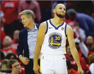  ??  ?? LEFT: The Golden State Warriors’ Stephen Curry reacts to a foul call during the fourth quarter of Game 5 of the Western Conference Finals against the Houston Rockets on Thursday night in Houston. The Rockets won 98-94 to take a 3-2 lead in the series....