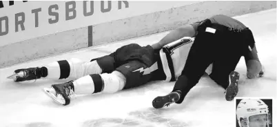  ?? GETTY IMAGES ?? The Lightning’s Erik Cernak is treated by a trainer after being leveled by Hawks defenseman Connor Murphy (inset) on Sunday at the United Center. Murphy was assessed a match penalty for a hit to the head.