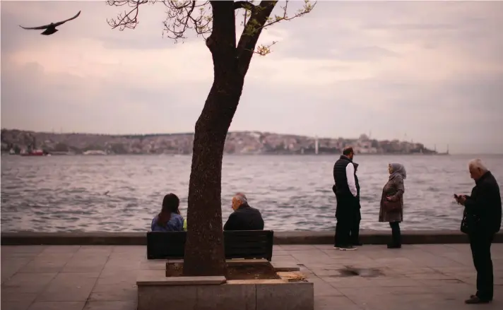  ?? Photo: Francisco Seco, AP ?? People relax in Besiktas sea promenade at the Bosphorus, in Istanbul, Turkey.