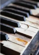  ?? Staff photos by Evan Lewis ?? left
An old piano is photograph­ed Monday at Cedar Grove Church in Genoa, Ark. The church was built in 1883.