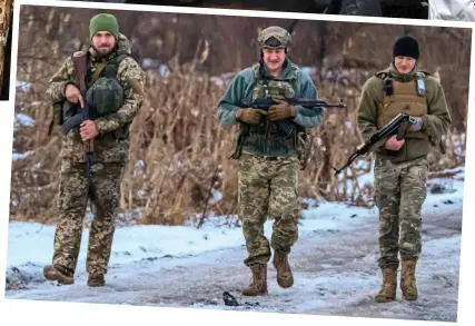  ?? ?? Snow patrol: Ukraine soldiers return to their base after frontline manoeuvres near Kupyansk